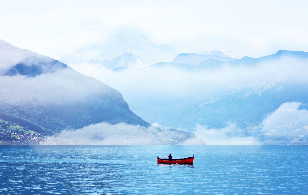 Fishing on a warm summer day on Lake Thun in Gunten, Switzerland ...