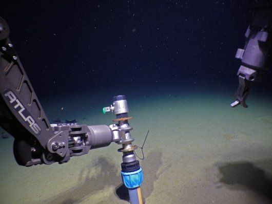 View from deep sea research vessel of sediment coring device on the bottom of the Arctic Ocean