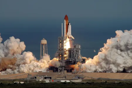 Launch of the STS-122 shuttle mission from Cape Canaveral. Re-entry is quieter, but more spectacular visually.