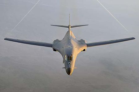 A B-1B Lancer flies a combat patrol over Afghanistan in support of Operation Enduring Freedom. The B-1B has the capability to carry guided and unguided weapons and deliver massive quantities of precision and non-precision weapons against specific targets. (U.S. Air Force photo/Staff Sgt. Aaron Allmon)