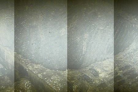 The hole in the grate below the pressure vessel in reactor 2, possibly caused by melted nuclear material