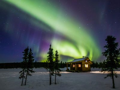 Northern lights over a wilderness cabin near Fairbanks, Alaska.