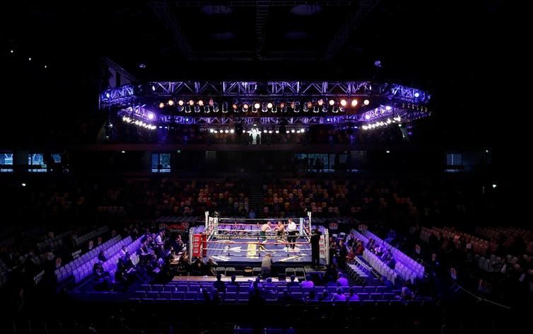 A boxing match takes place in London’s Copper Box Arena in 2013.
