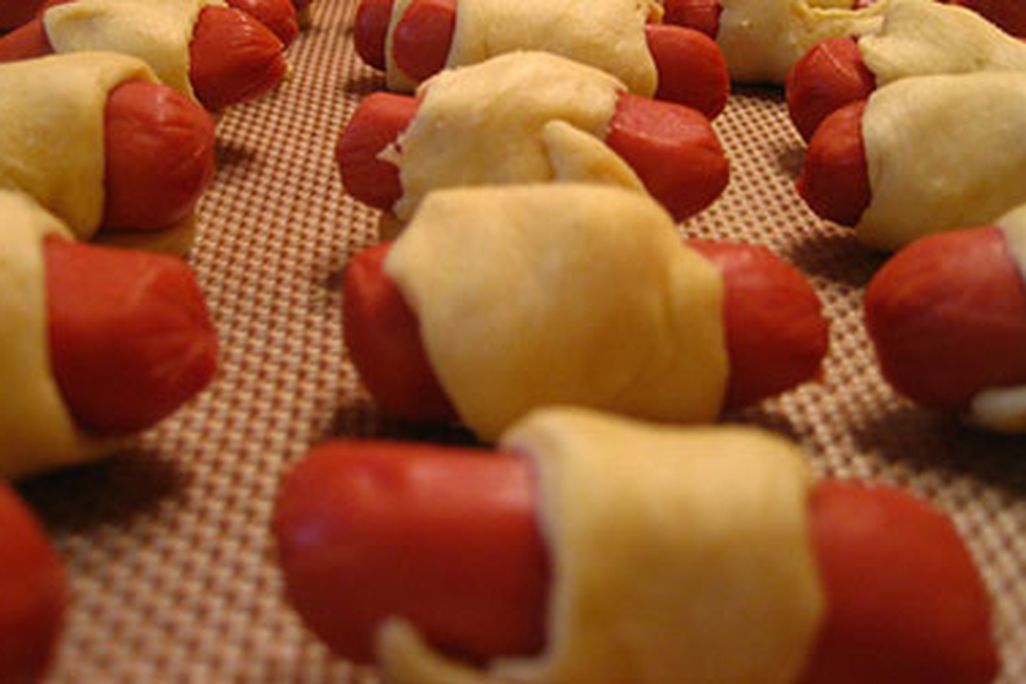 Making pigs in a blanket was a "true test of patience and stealth" for the author