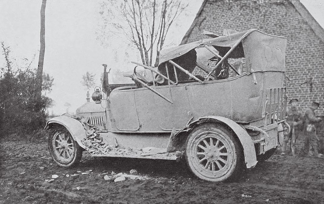 Coleman’s smashed White Model 30 after a hit by a German shell and brick debris outside Messines, Belgium. Coleman was not in  the car.