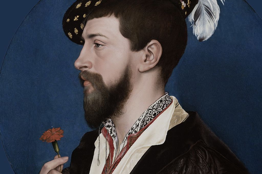 A circular portrait of a pale man with dark hair and beard, side profile, wearing a feathered hat and holding a red flower in one hand