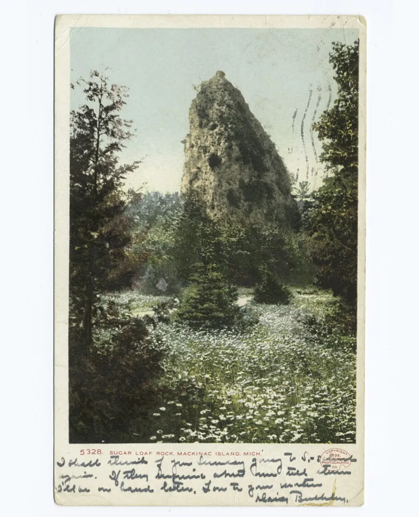 A postcard of Sugar Loaf Rock on Mackinac Island
