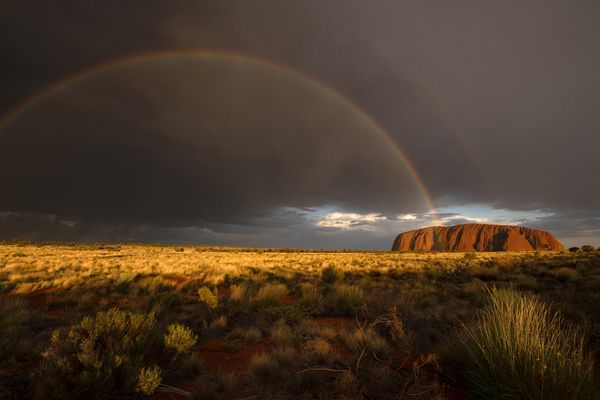 Double rainbow in sunset light, Uluru, Australia thumbnail