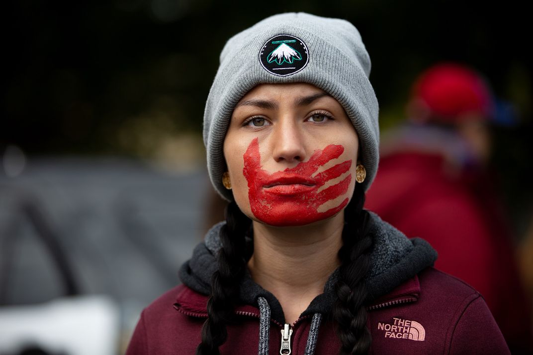 A participant in a 2018 protest raising awareness of missing and murdered Indigenous women and girls