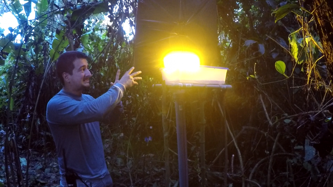 Smithsonian researcher Christian Luces turning on one of the traps used in the study.