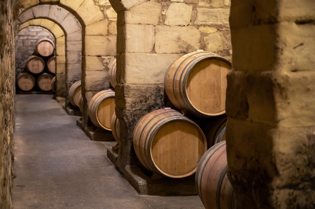 Oak barrels stored in a Rioja wine cellar