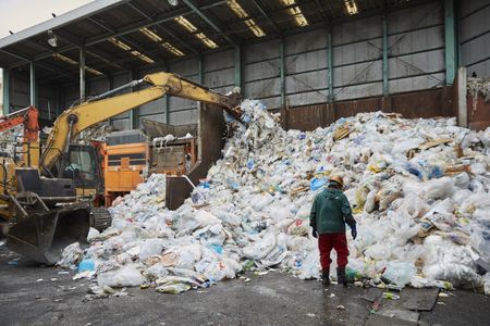 Worker at a plastic recycling plant in Japan.