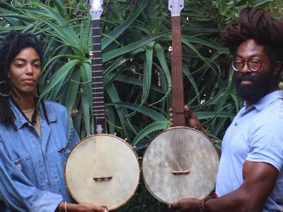 Black Banjo Reclamation Project founders Hannah Mayree and Carlton “Seemore Love” Dorsey, with banjos made by Brooks Masten of Brooks Banjos in Portland, Oregon. (Photo by Avé-Ameenah Long)
