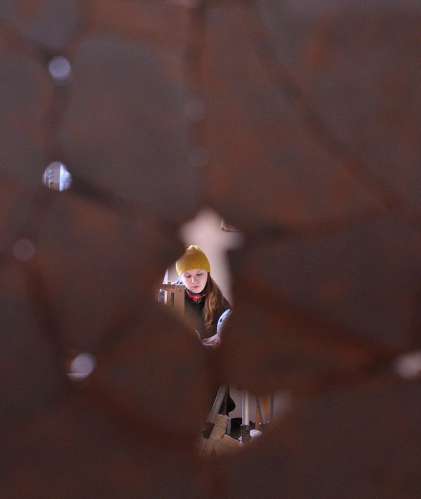 Girl was photographed through the wall of a clay vessel. thumbnail