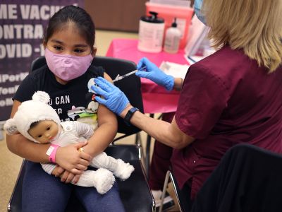 A first grade student receives a Covid-19 vaccine in Chicago, Illinois