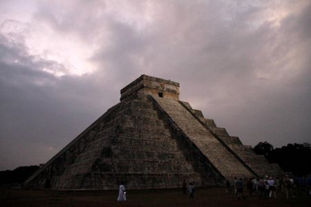 In this Dec. 21, 2012 file photo, people gather in front of the Kukulkan temple in Chichen Itza, Mexico. Mexican experts said Wednesday, Nov. 16, 2016 they have discovered what may be the original structure at the pyramid of Kukulkan at the Mayan ruins of Chichen Itza.
