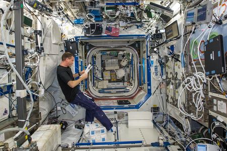 Reid Wiseman finds a little peace and quiet in the station’s Destiny lab.