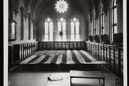 A 1914 photo of the Star-Spangled Banner undergoing conservation in the Smithsonian Castle