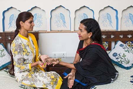 Tulsi Yadav teaches Shoba Narayan about the application and design of mehndi, or henna, at the Dera Mandawa haveli in Jaipur, Rajasthan. Formerly a private mansion, the Dera Mandawa is now a hotel.