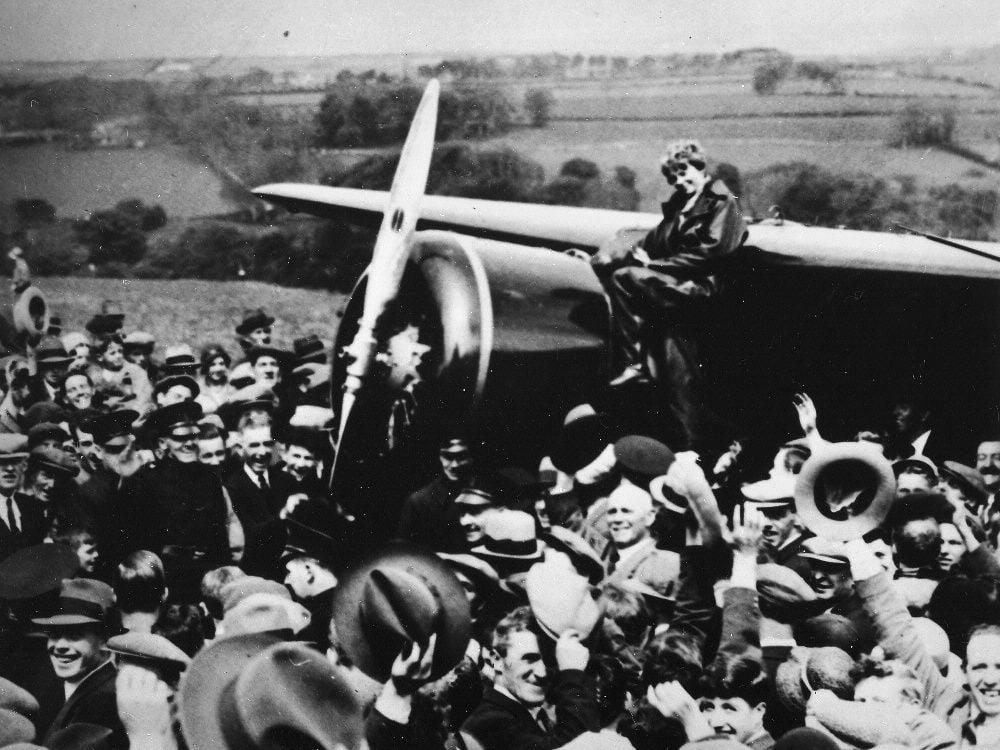 Earhart first crossed the Atlantic in 1928, as a passenger. Four years later, she flew solo from Newfoundland to Ireland in a Lockheed Vega. Here, the beaming villagers of Culmore, North Ireland, pay homage to the rising star.
