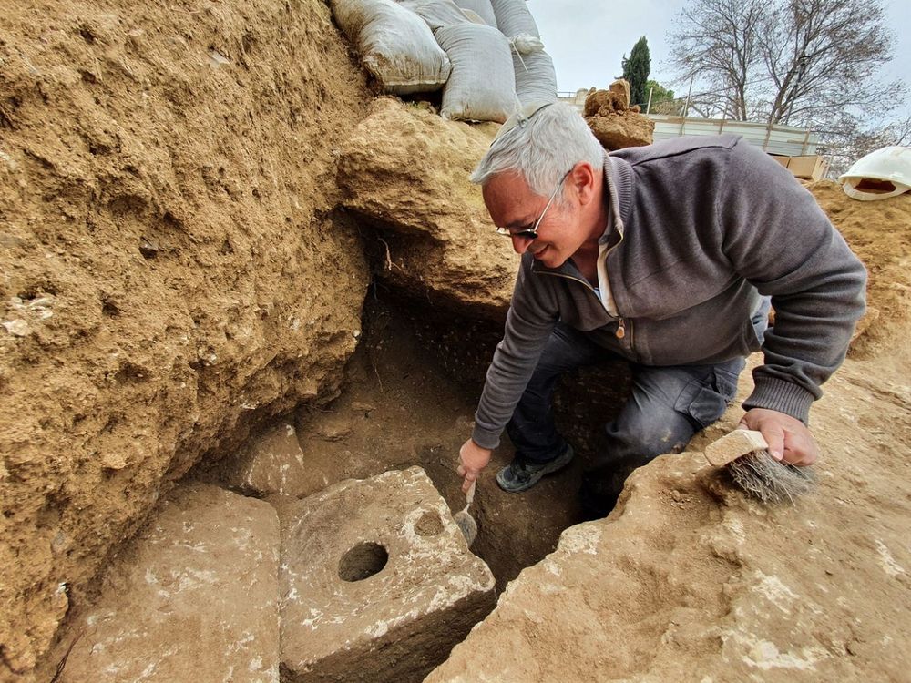 Archaeologists examines the toilet