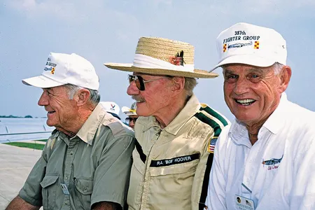 Bob Hoover, center, enjoying a day at the Oshkosh airshow with two other legends, Chuck Yeager, left, and Clarence "Bud" Anderson. 