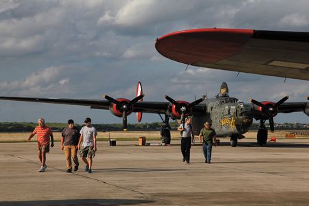 At the end of a busy day, the roadies walk away from the last B-24J left flying. From left: Pilots Mac McCauley and Robert Pinksten, and mechanics Gary Dunn, Chris Hurford, and Robert Wyatt.