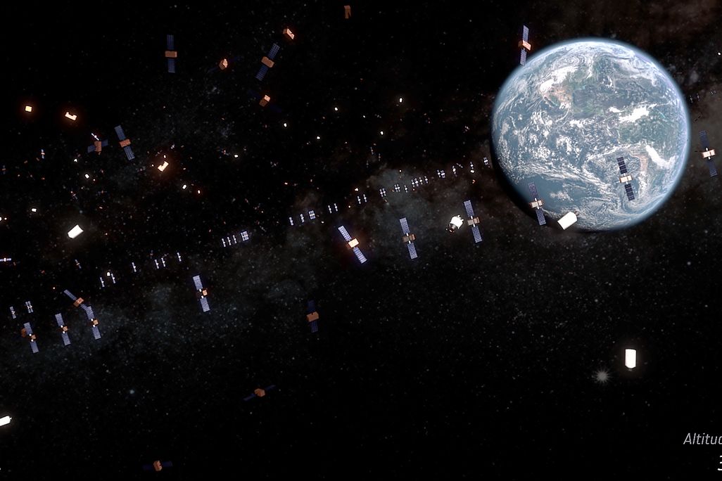 illustrated debris and satellites float through space, with Earth visible at the top right