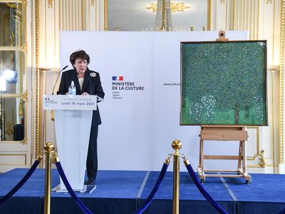 French Culture Minister Roselyne Bachelot stands next to Gustav Klimt&#39;s oil painting&nbsp;Rosebushes under the Trees (1905), as she announces the return of 15 Nazi-looted artworks to Jewish families&nbsp;at an event at Musee d&#39;Orsa in Paris.