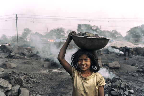 A young girl working in coal field thumbnail