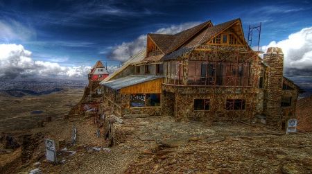The lodge at Bolivia’s Chacaltaya Glacier was once the world’s highest ski resort—until the glacier melted away almost entirely in just 20 years. The lodge closed its ski facilities in 2009 and stands today amid a rocky, almost snowless moonscape.