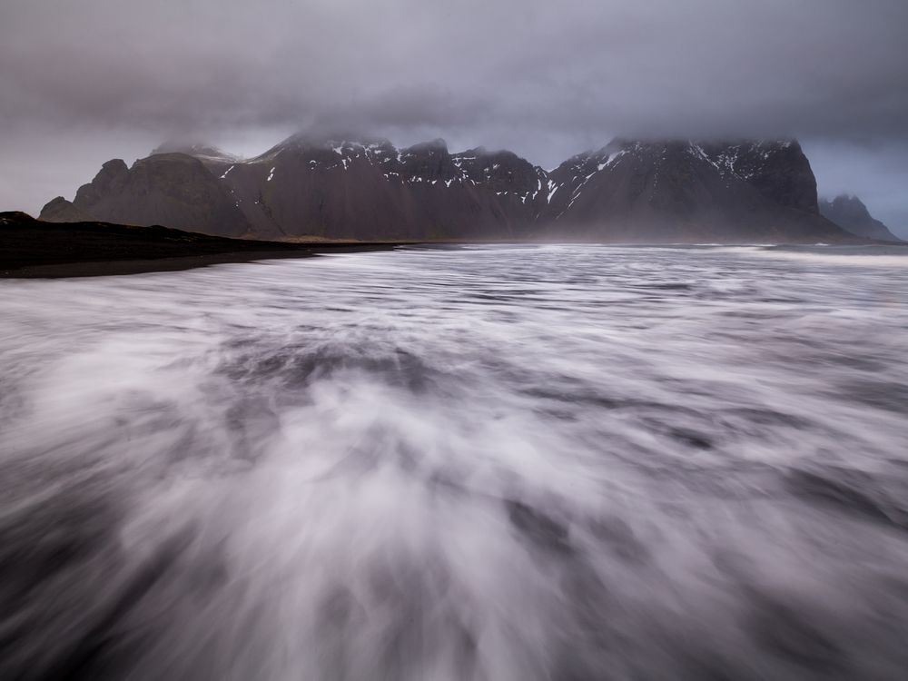 Black sand beach in Iceland and mountains Smithsonian Photo Contest