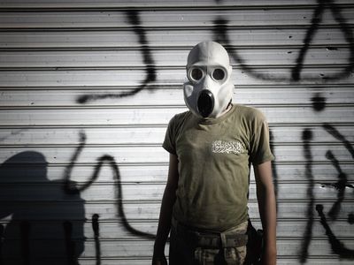 A Syrian rebel fighter wears a gas mask in 2013.