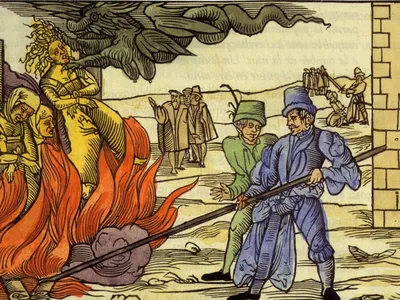 A 14th-century illustration depicts accused witches being burned at the stake. More than 2,500 witches were executed under Scotland&#39;s 1563 Witchcraft Act.