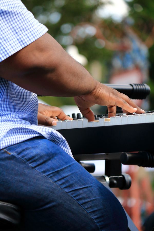 A black keyboardist playing in a blues band thumbnail