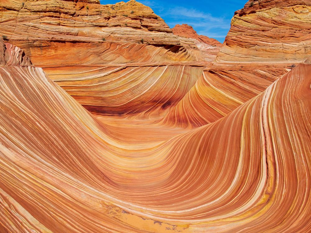 A stunning landscape featuring a wavy sandstone rock formation
