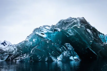 The underside of this recently flipped iceberg is glassy and free of debris.