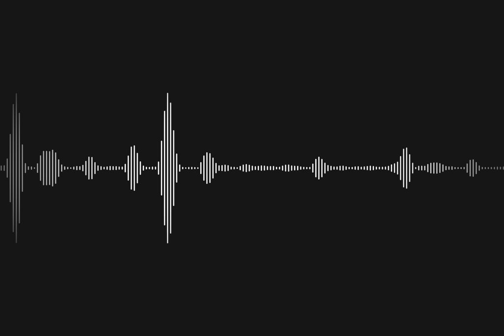 A visual of blips of sound waves on a black background