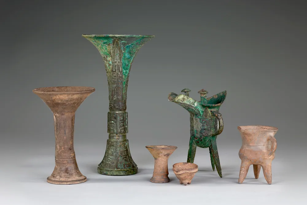 Grouping of bronze wine cups and warmers