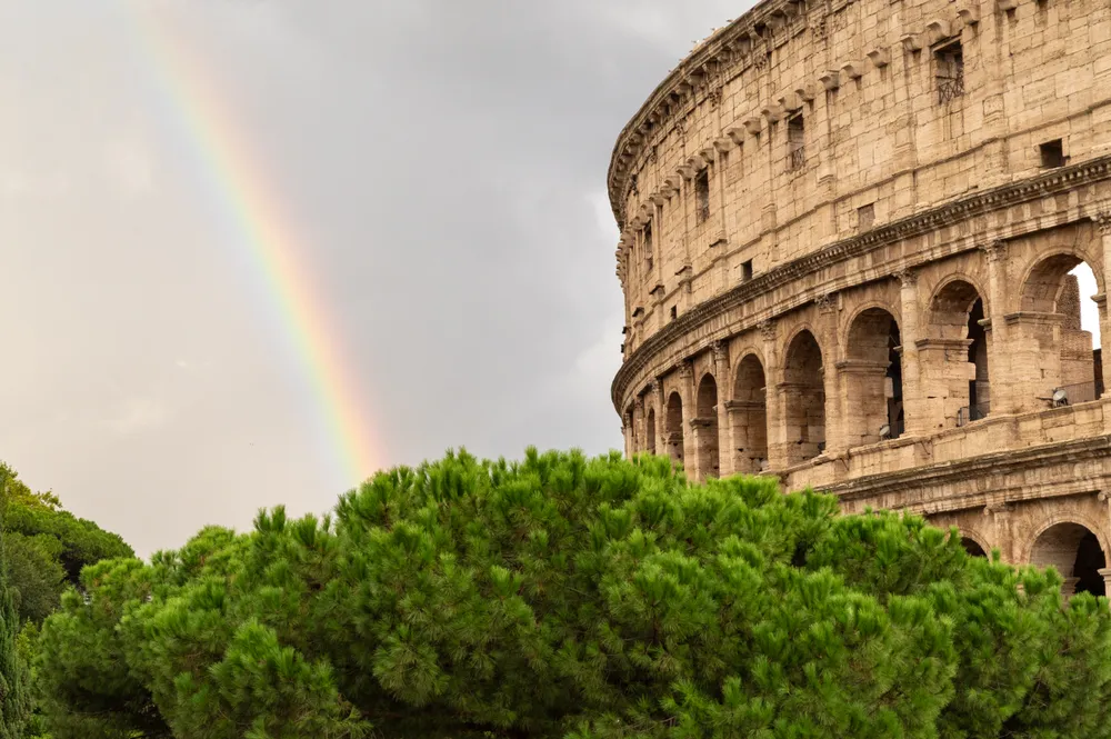 A rainbow arched over the Colosseum just after a passing shower, bringing unexpected color to one of Rome’s most historic landmarks. Locals and tourists paused along the street as the light shifted, and the moment felt like a brief mix of ancient history and everyday life in the city.