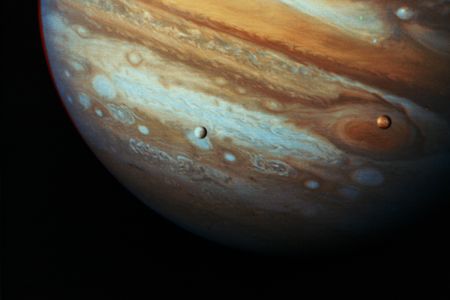 Jupiter with moons Io and Europa as seen by the Voyager I probe
