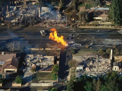Not a movie still: Fire rages on a flooded street following the 1994 Northridge earthquake in California.