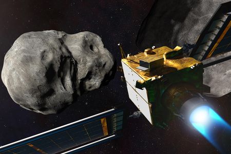 An illustration of the DART spacecraft next to the asteroid, Dimorphos, and the larger asteroid it orbits, Didymos.