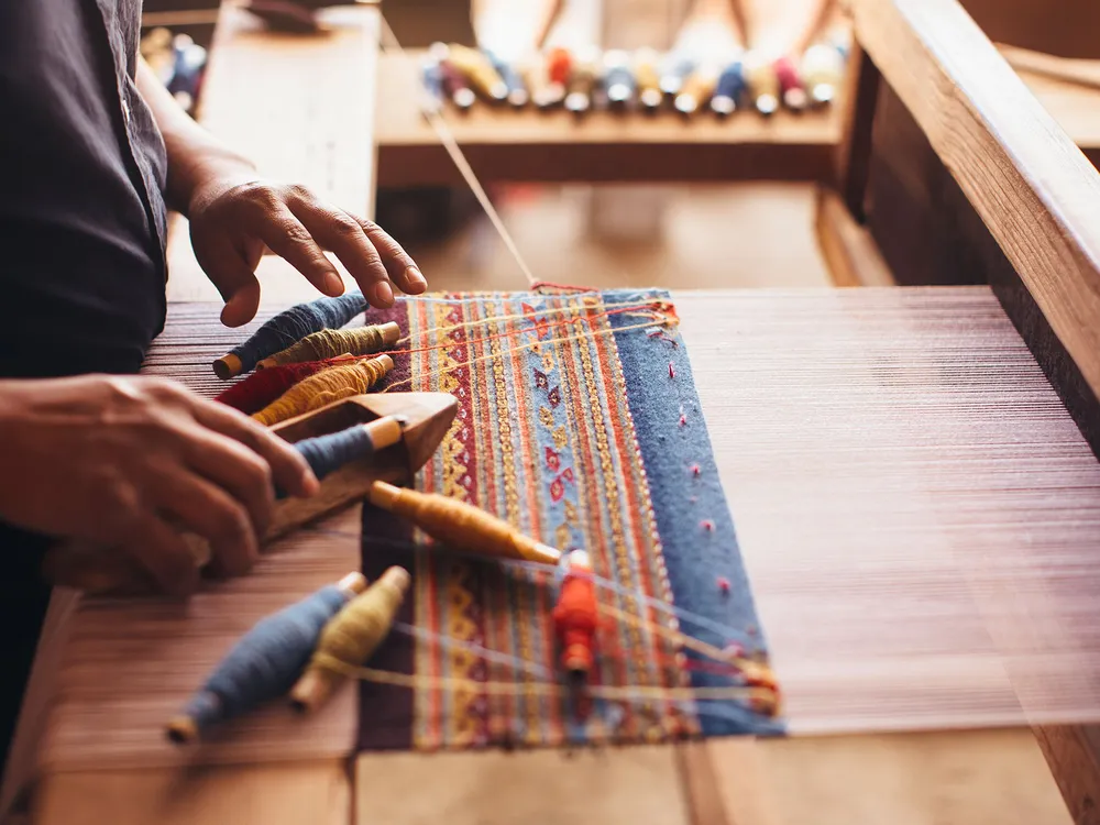 Zapotec weaver Porfirio Gutiérrez at work in his studio. (Photo courtesy of the artist)