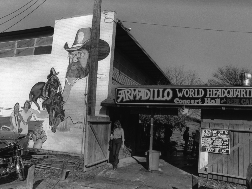 A black and white image of the entrance to the Armadillo venue