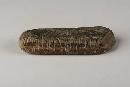 The stone has inscriptions on three sides.