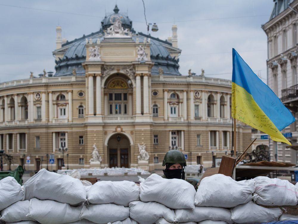 A soldier standing guard over the Odesa Opera and Ballet Theater in March 2022