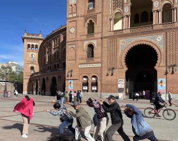 Tourists pretending to bullfight in Madrid thumbnail