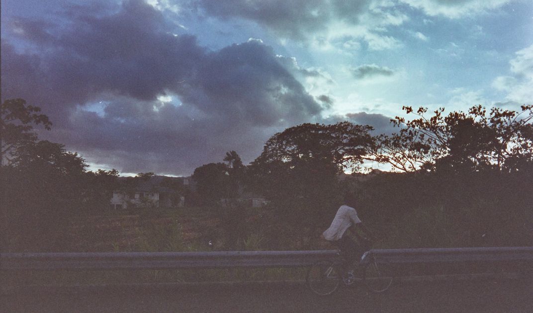 A man rides his bike down along the T3 road