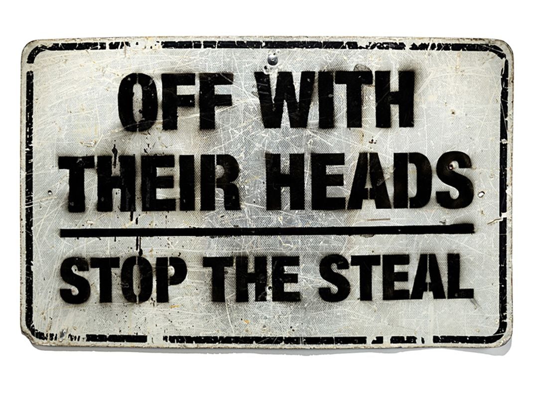 repurposed metal road sign reading 'off with their heads stop the steal'